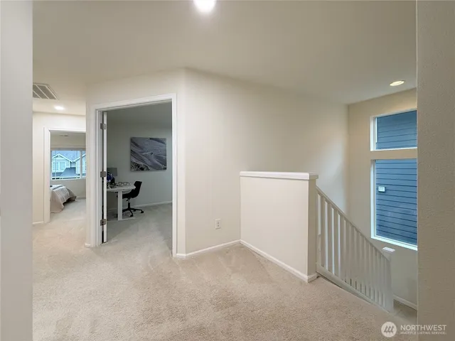 a bed room with a bed and a night stand