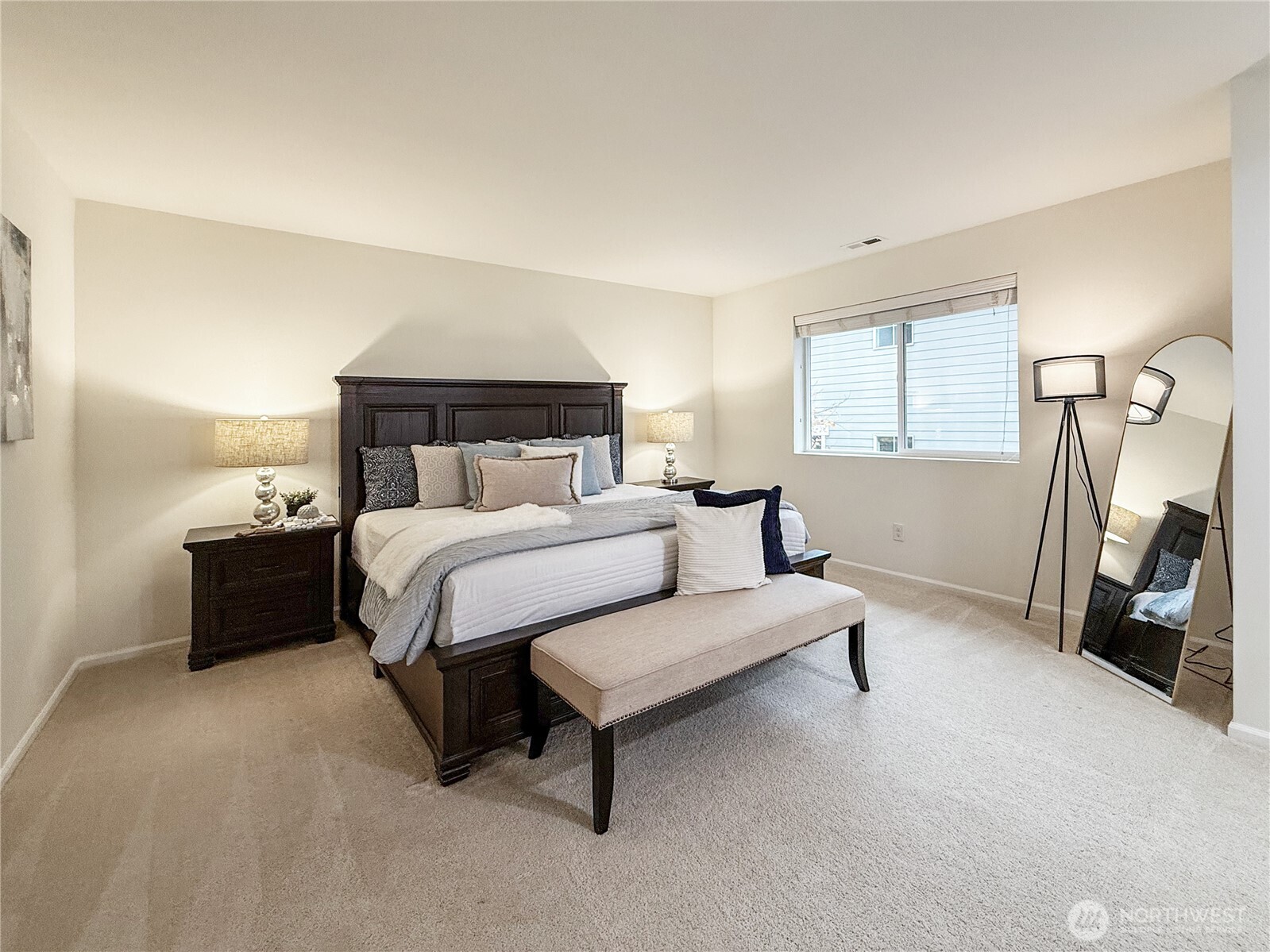 3918 177th Street Southeast Bothell, WA 98012 - Photo 19 of 39 a bed room with a bed and a night stand