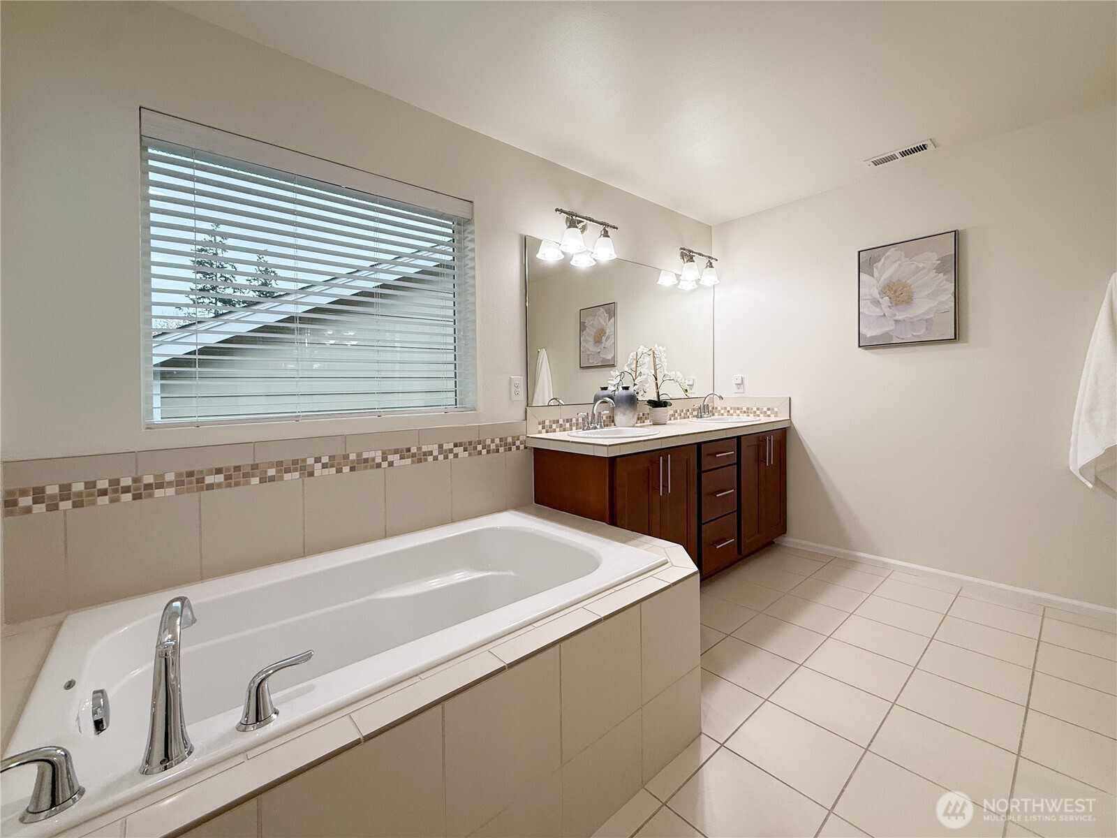 3918 177th Street Southeast Bothell, WA 98012 - Photo 22 of 39 a bathroom with a tub sink and mirror