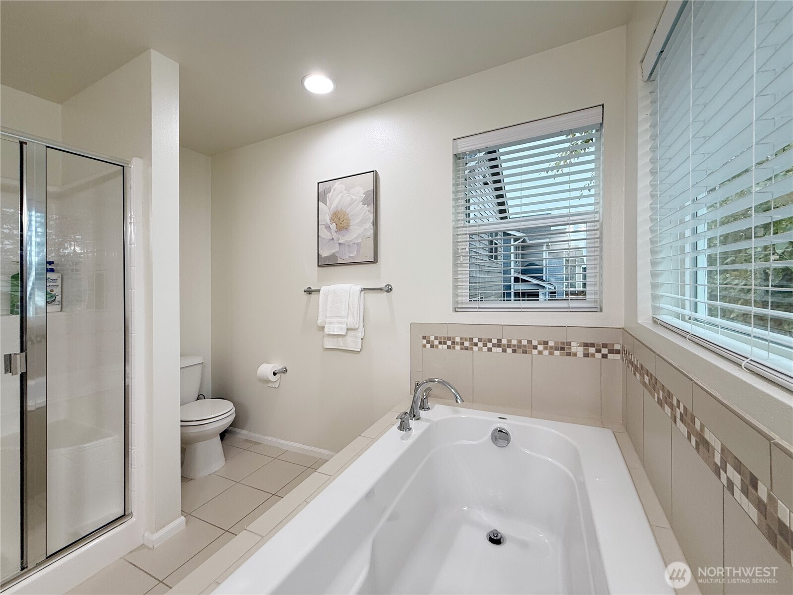 3918 177th Street Southeast Bothell, WA 98012 - Photo 23 of 39 a bathroom with a tub a toilet and a sink