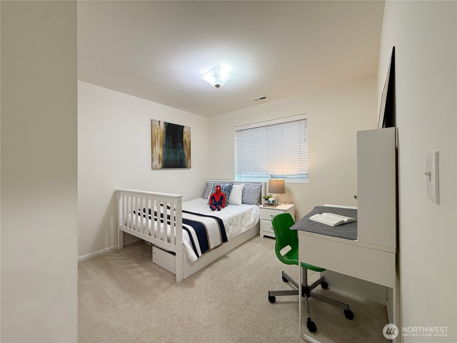 3918 177th Street Southeast Bothell, WA 98012 - Photo 24 of 39 a bedroom with a bed desk and a window