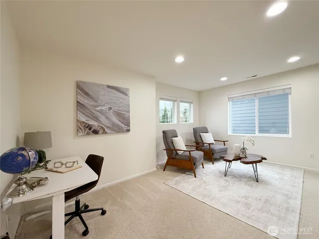 a bedroom with a large bed and a large window