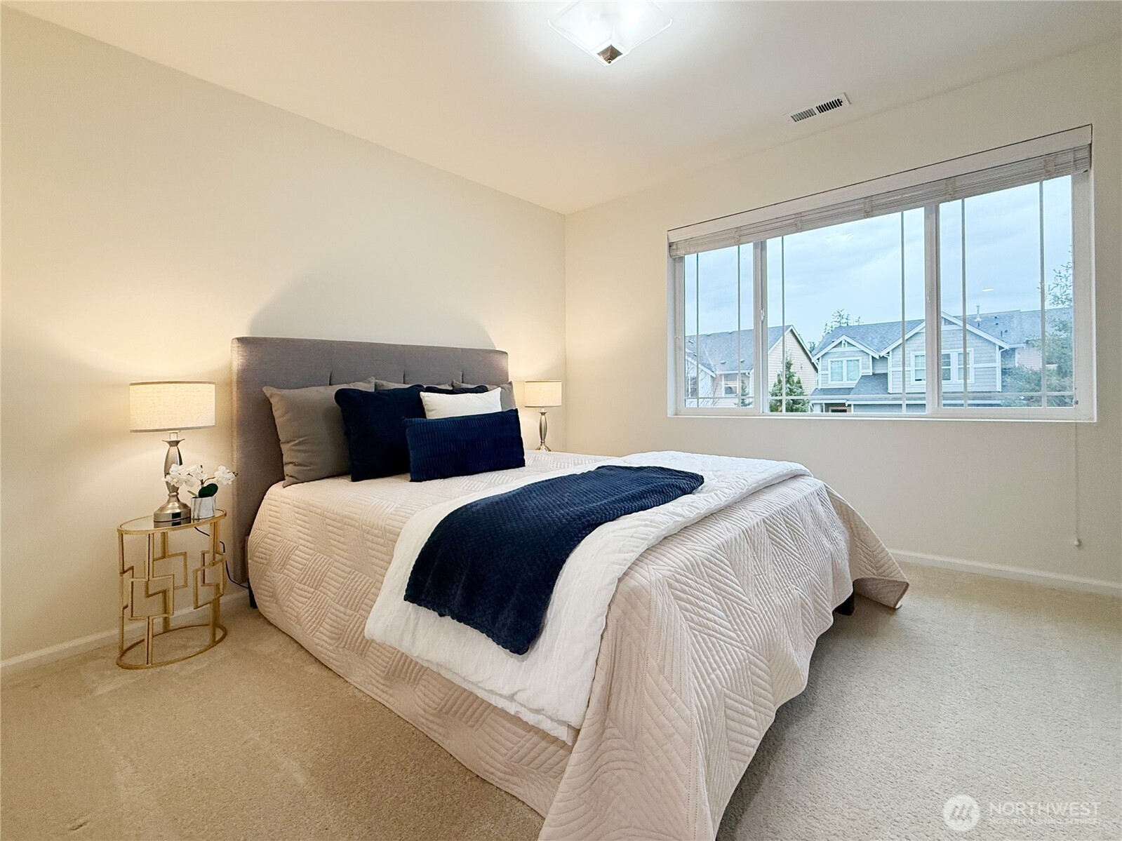 3918 177th Street Southeast Bothell, WA 98012 - Photo 26 of 39 a bedroom with a large bed and a large window