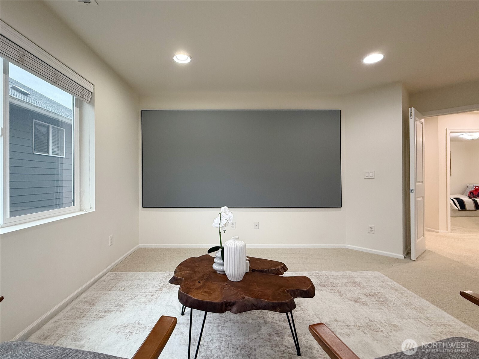 3918 177th Street Southeast Bothell, WA 98012 - Photo 30 of 39 a living room with furniture and a flat screen tv