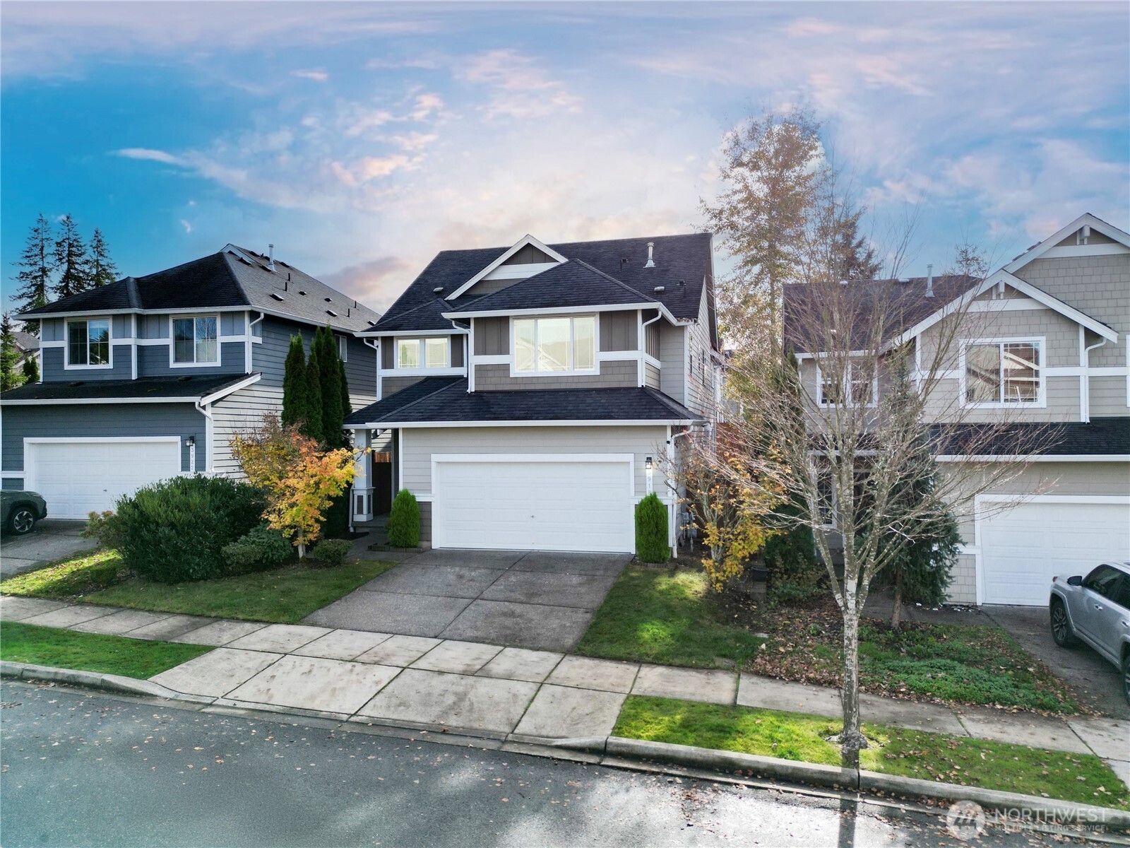 3918 177th Street Southeast Bothell, WA 98012 - Photo 3 of 39 a front view of a house with a garden and plants