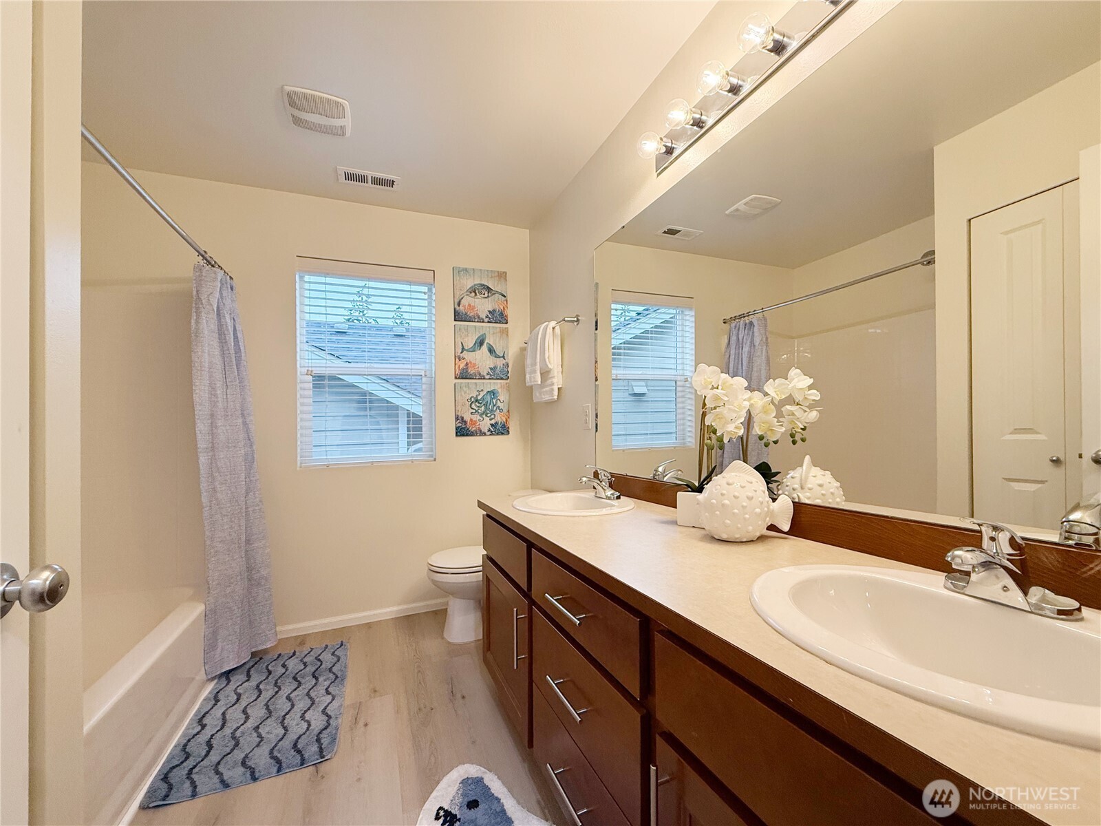 3918 177th Street Southeast Bothell, WA 98012 - Photo 31 of 39 a bathroom with a sink double vanity and a mirror