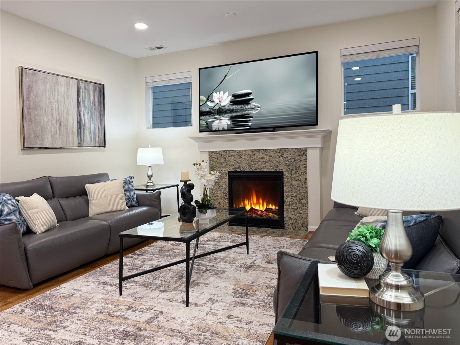 3918 177th Street Southeast Bothell, WA 98012 - Photo 6 of 39 a living room with furniture and a fireplace