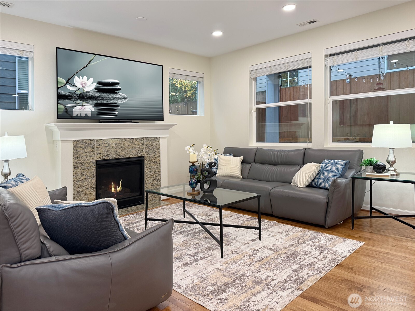 3918 177th Street Southeast Bothell, WA 98012 - Photo 7 of 39 a living room with furniture and a fireplace