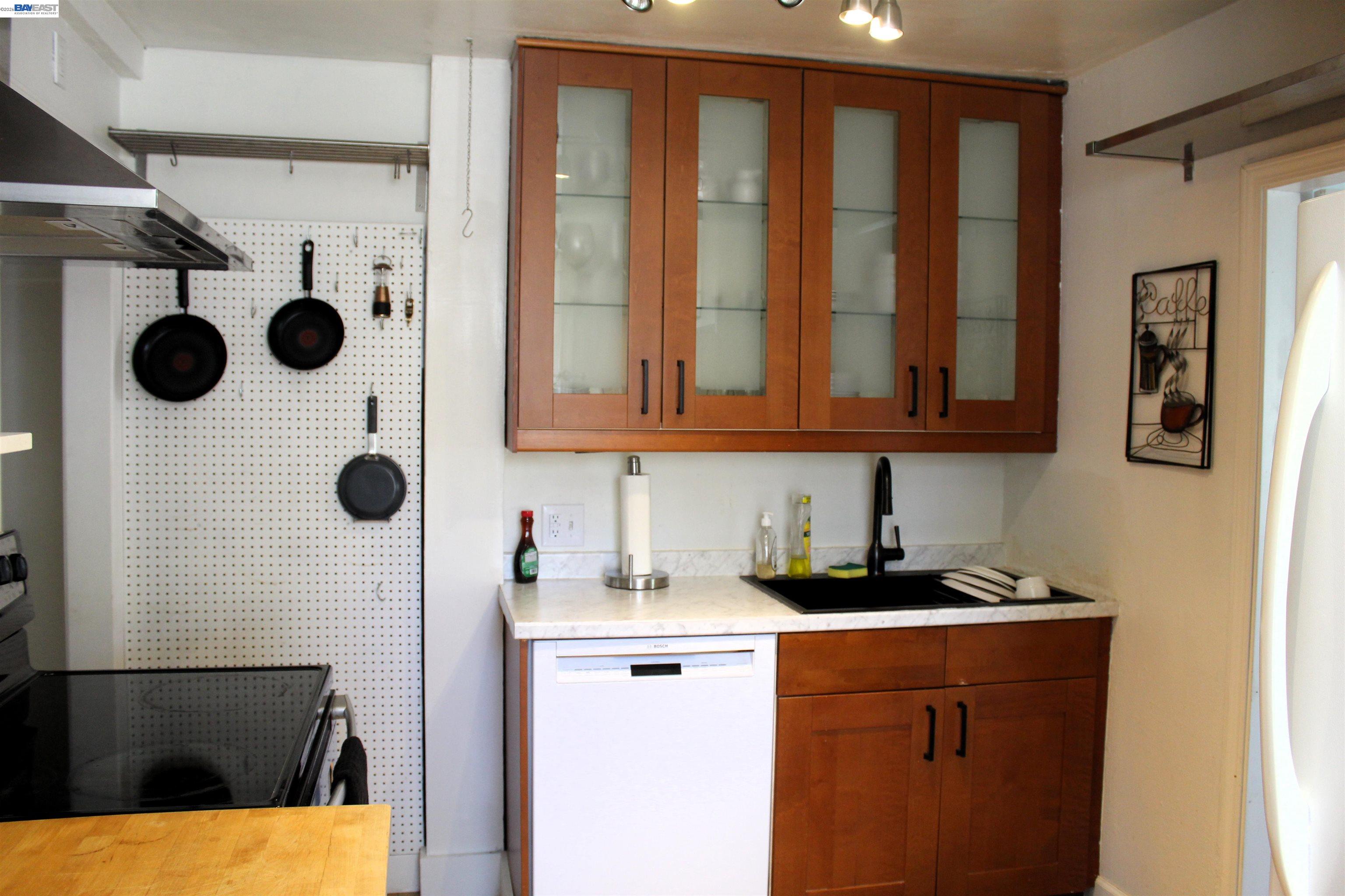 536 Williams Street Murphys, CA 95247 - Photo 15 of 24 a kitchen with a refrigerator and cabinets