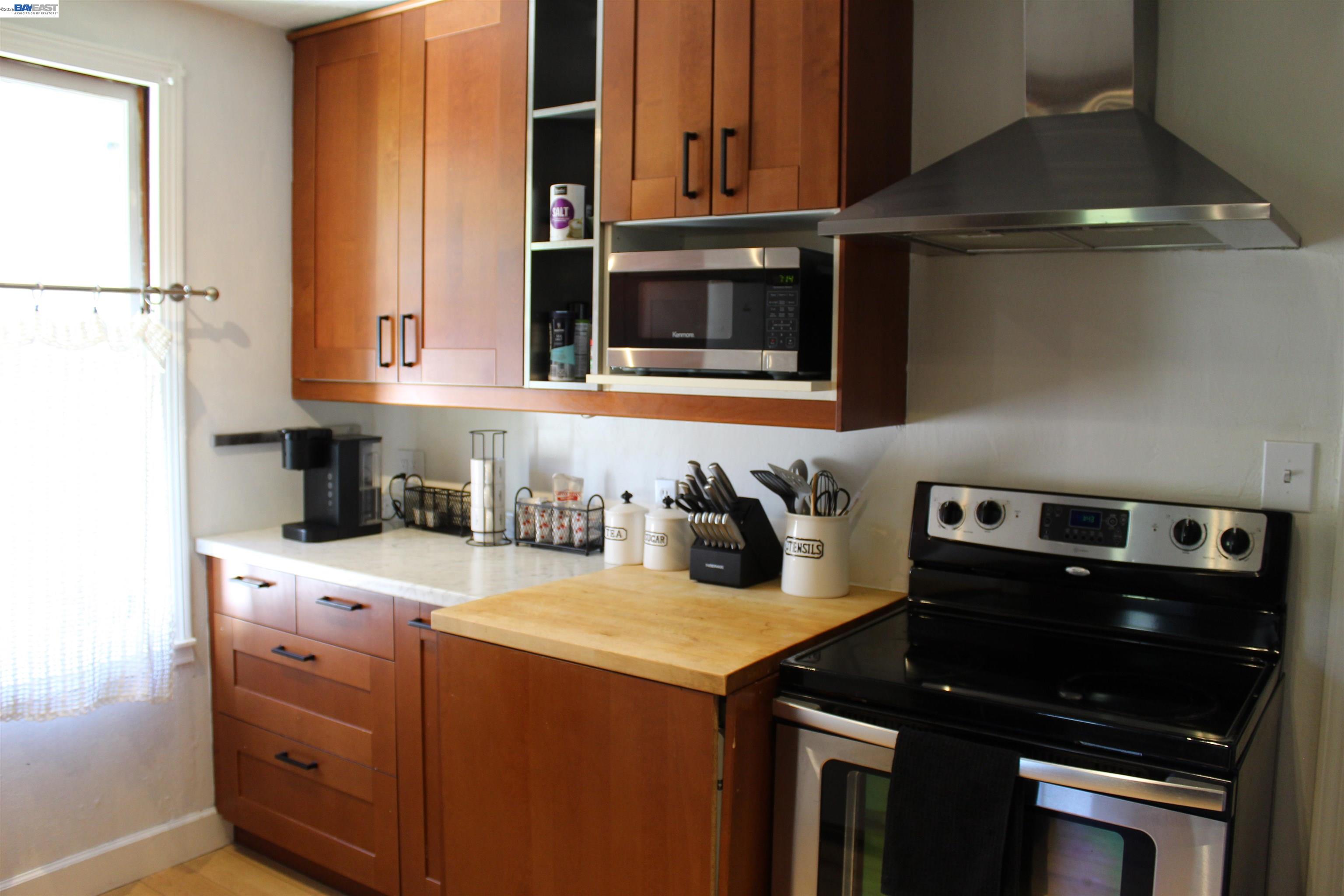 536 Williams Street Murphys, CA 95247 - Photo 16 of 24 a kitchen with a stove and a microwave