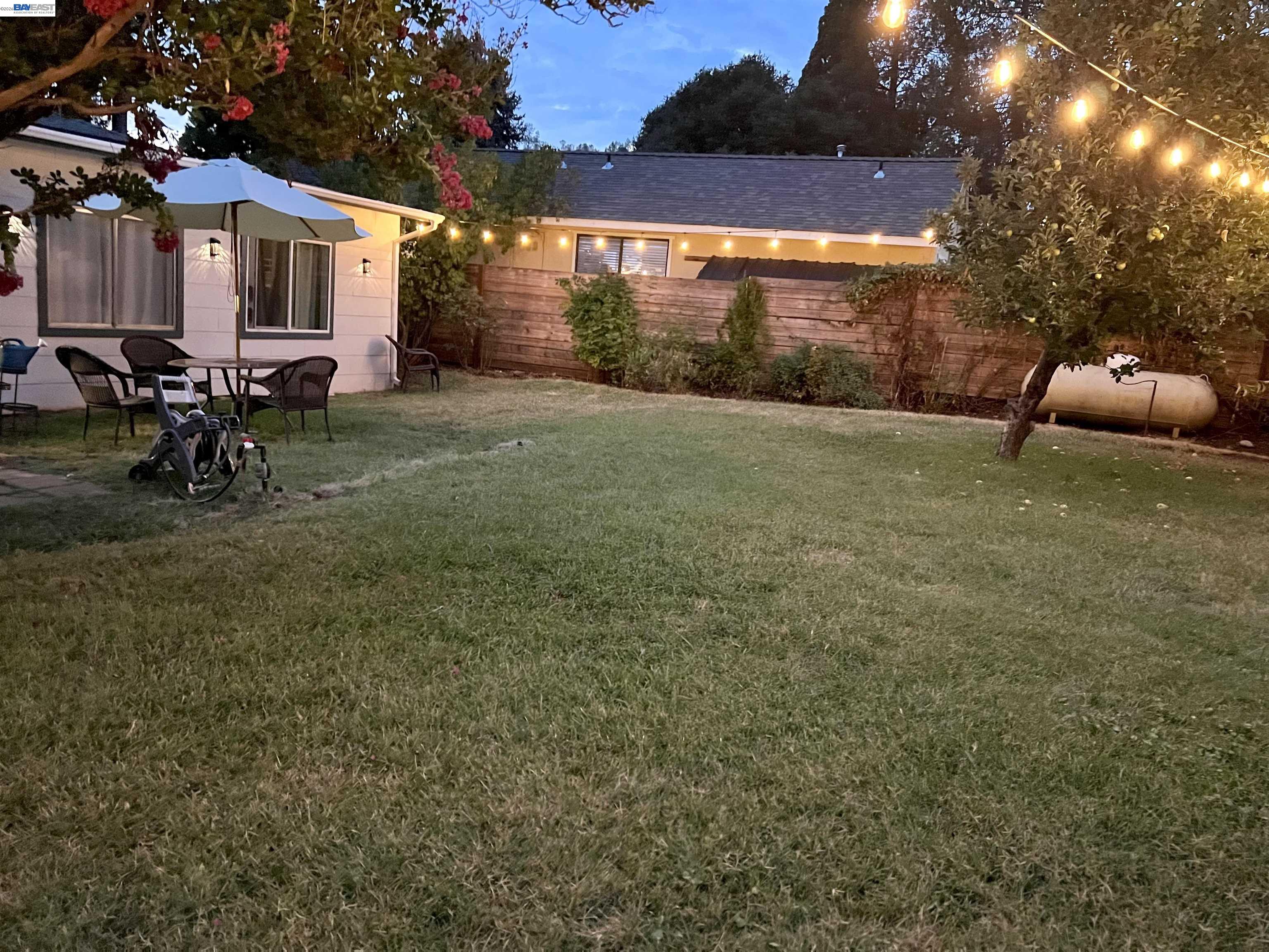 536 Williams Street Murphys, CA 95247 - Photo 20 of 24 a backyard of a house with table and chairs