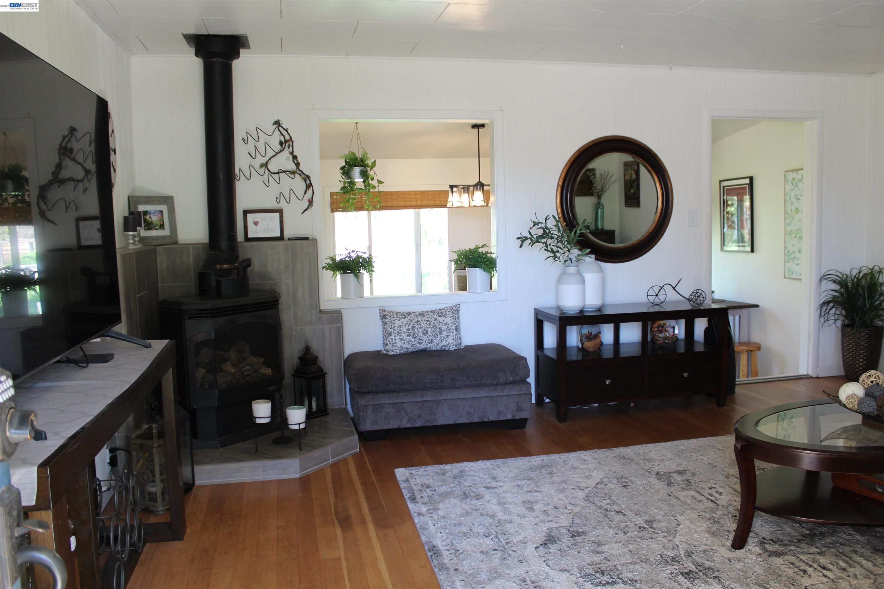 536 Williams Street Murphys, CA 95247 - Photo 3 of 24 a living room with furniture and a large mirror