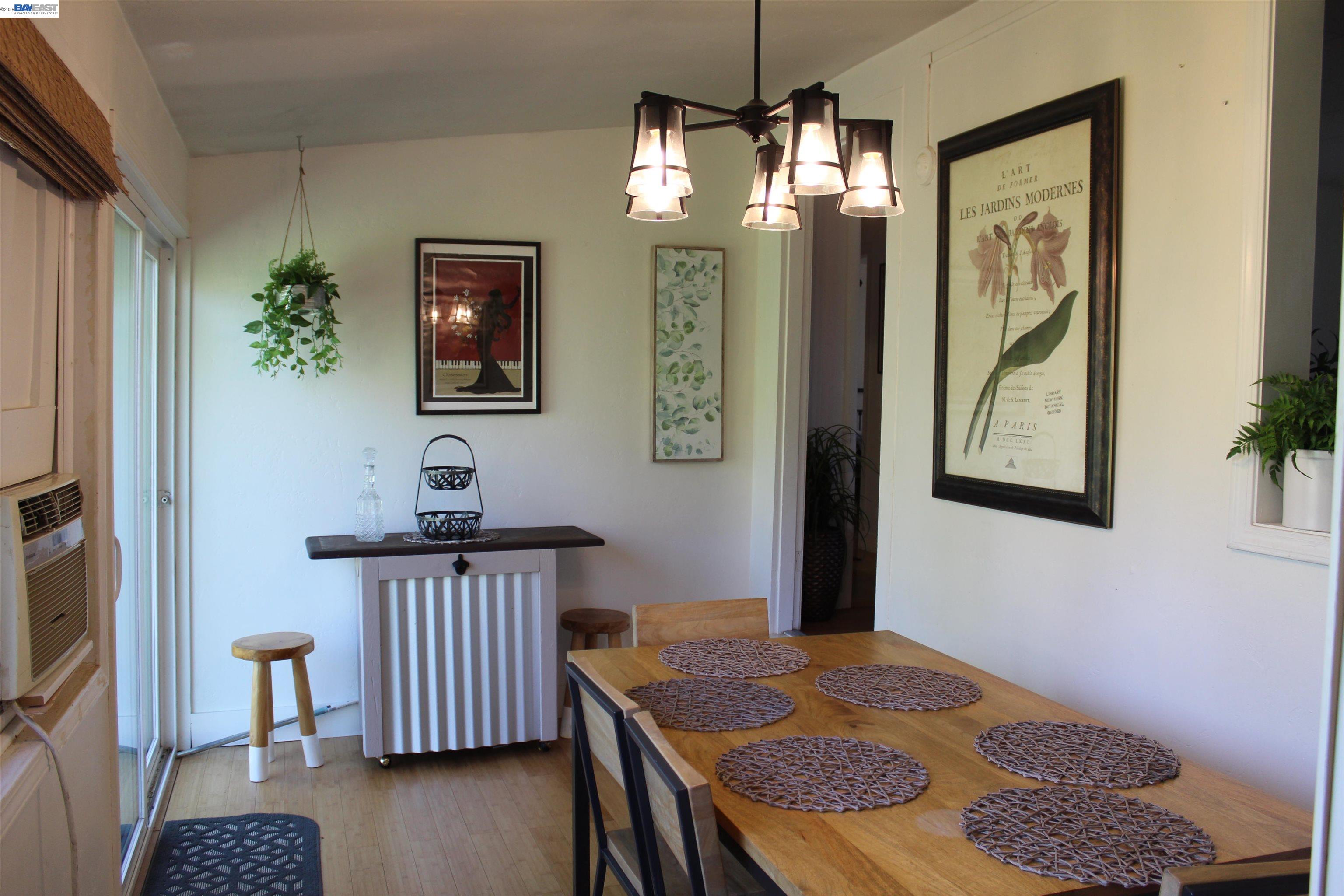 536 Williams Street Murphys, CA 95247 - Photo 5 of 24 a bedroom with a bed and a chandelier