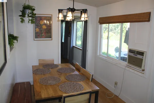a dining room with a table and chairs