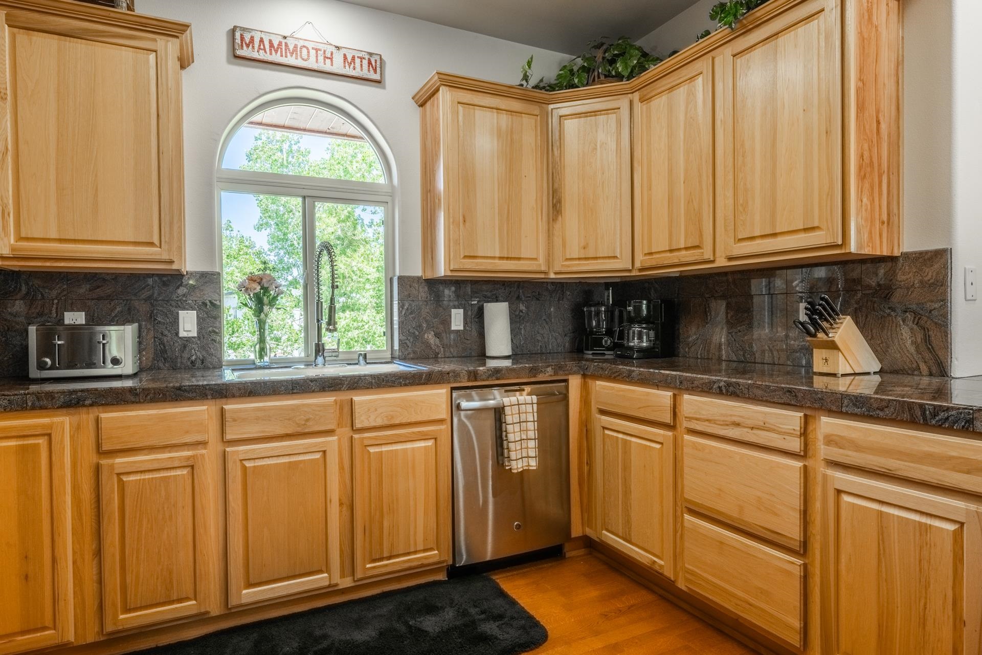372 Wagon Wheel Road Mammoth Lakes, CA 93546 - Photo 11 of 50 a kitchen with stainless steel appliances granite countertop a sink a stove and cabinets