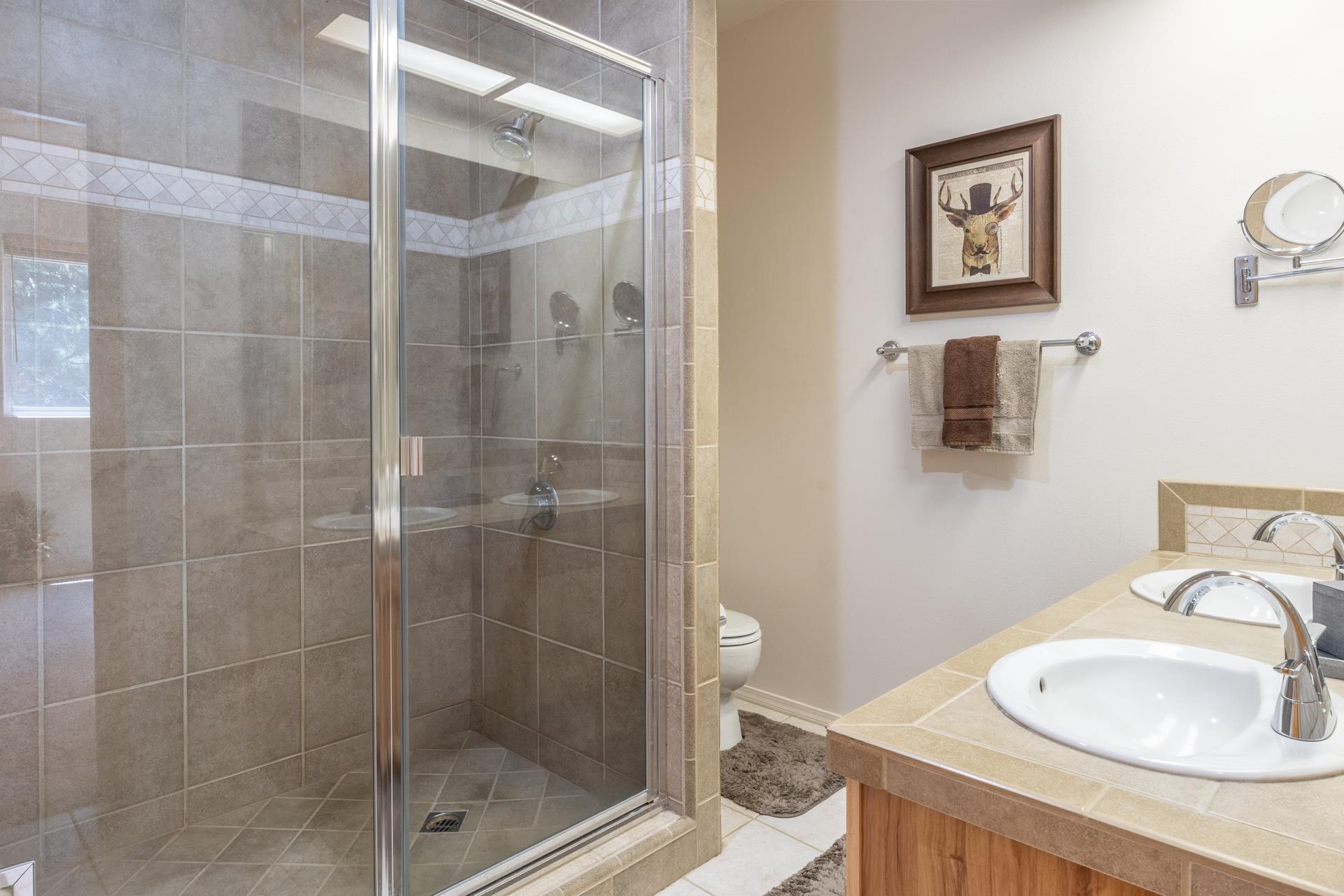 372 Wagon Wheel Road Mammoth Lakes, CA 93546 - Photo 19 of 50 a bathroom with a shower sink and mirror