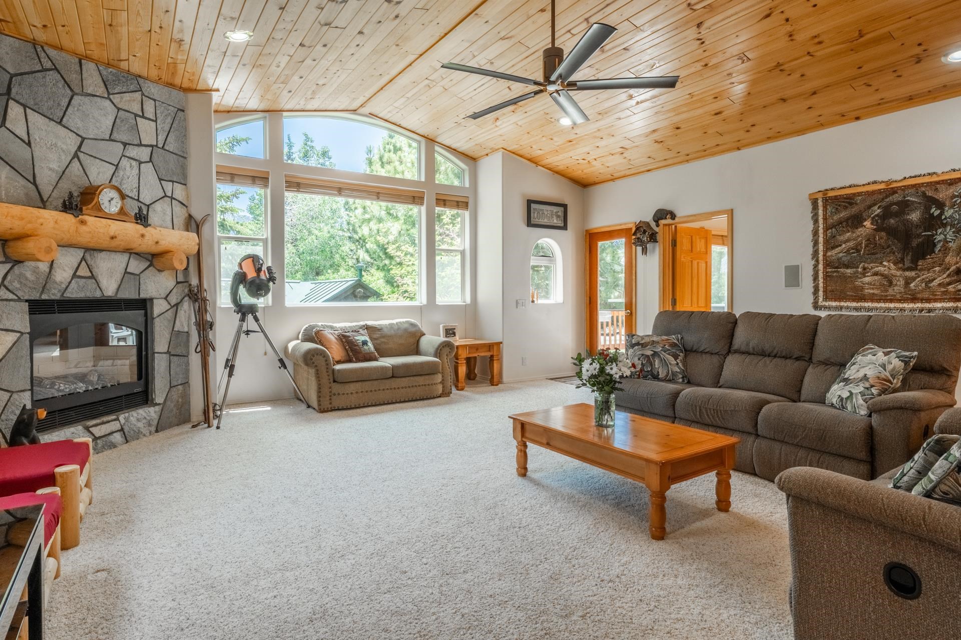372 Wagon Wheel Road Mammoth Lakes, CA 93546 - Photo 2 of 50 a living room with furniture a fireplace and a large window