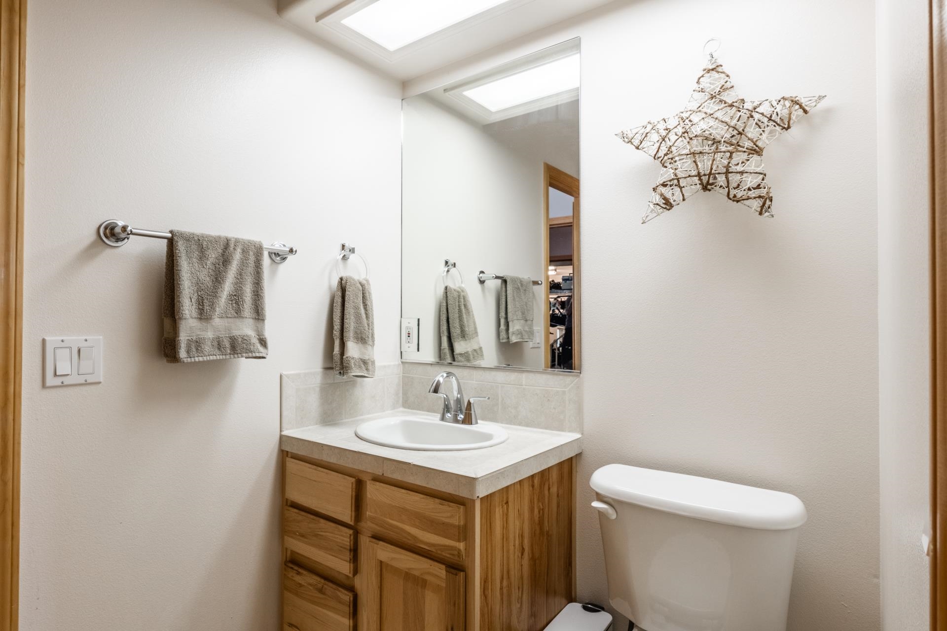 372 Wagon Wheel Road Mammoth Lakes, CA 93546 - Photo 34 of 50 a bathroom with a sink vanity mirror and toilet