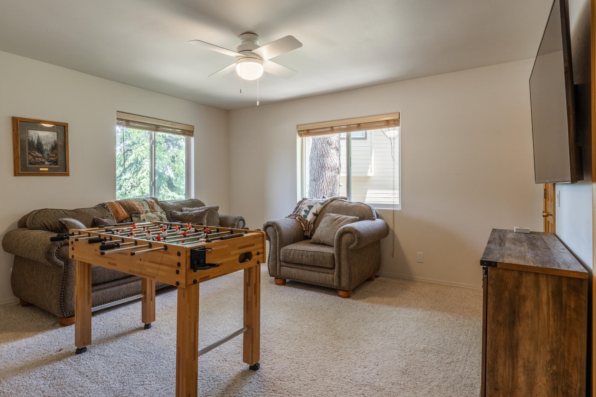 372 Wagon Wheel Road Mammoth Lakes, CA 93546 - Photo 36 of 50 a living room with furniture a flat screen tv and a window