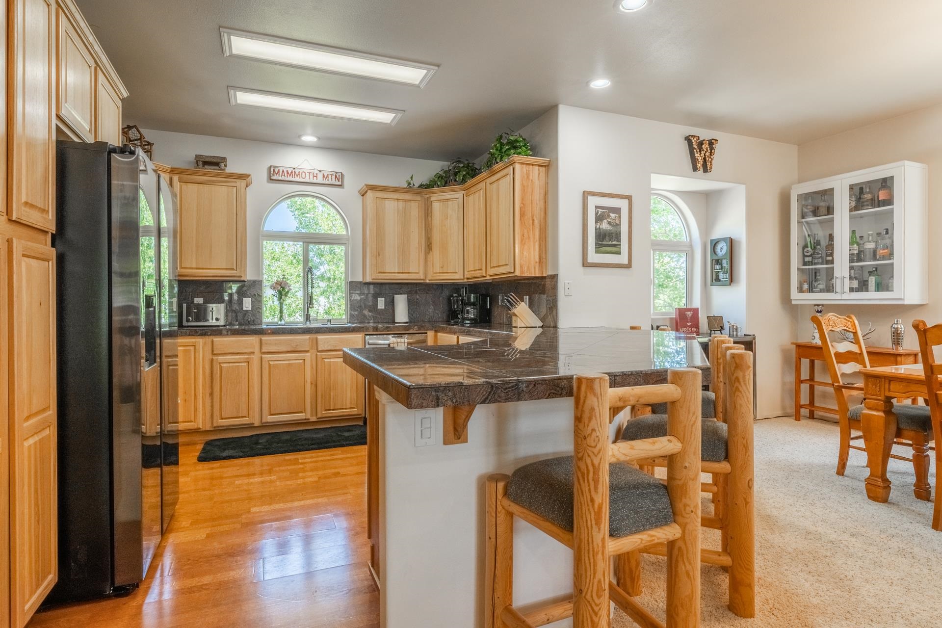 372 Wagon Wheel Road Mammoth Lakes, CA 93546 - Photo 4 of 50 a kitchen with stainless steel appliances granite countertop a stove a sink and a refrigerator