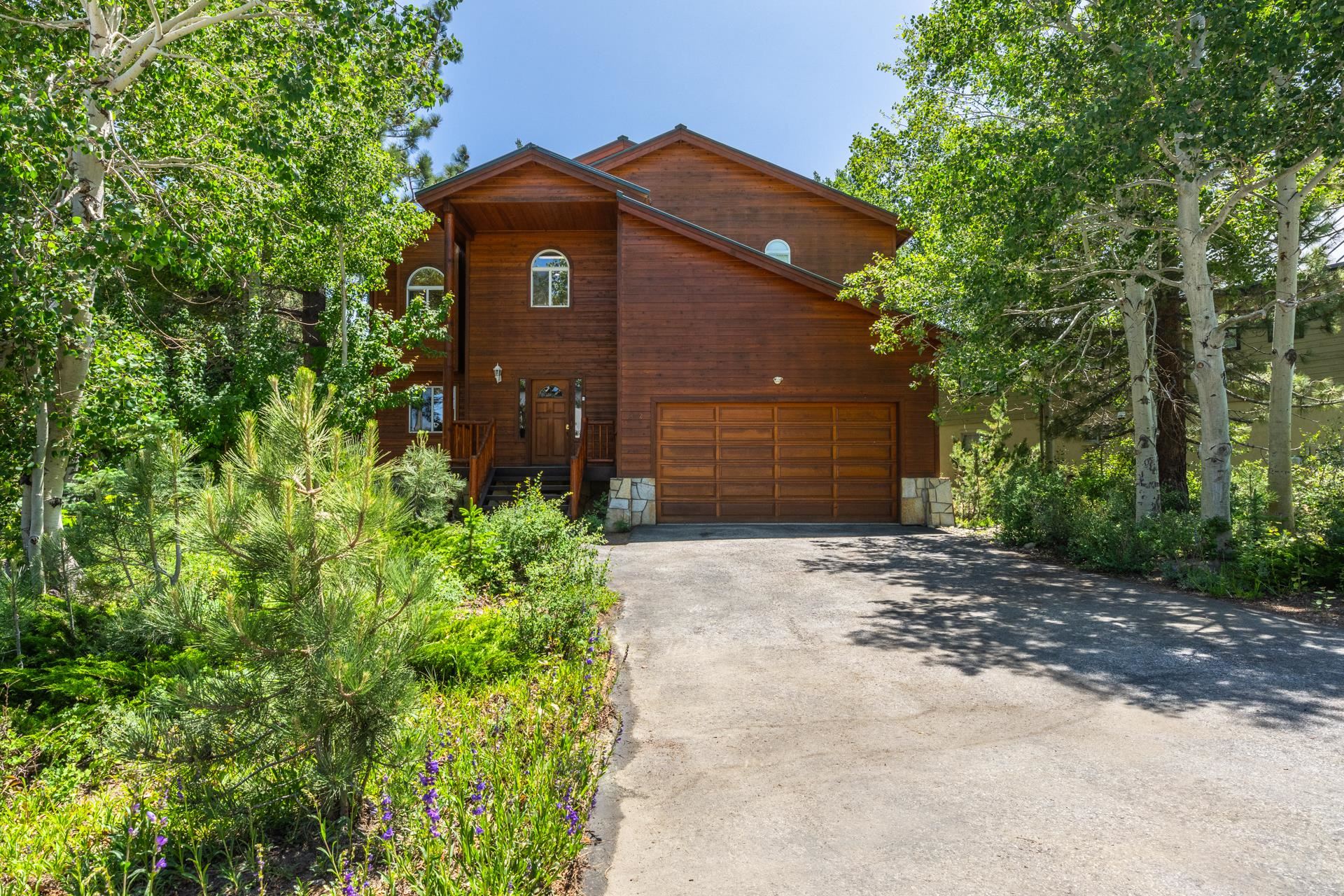 372 Wagon Wheel Road Mammoth Lakes, CA 93546 - Photo 46 of 50 a front view of a house with a yard and garage