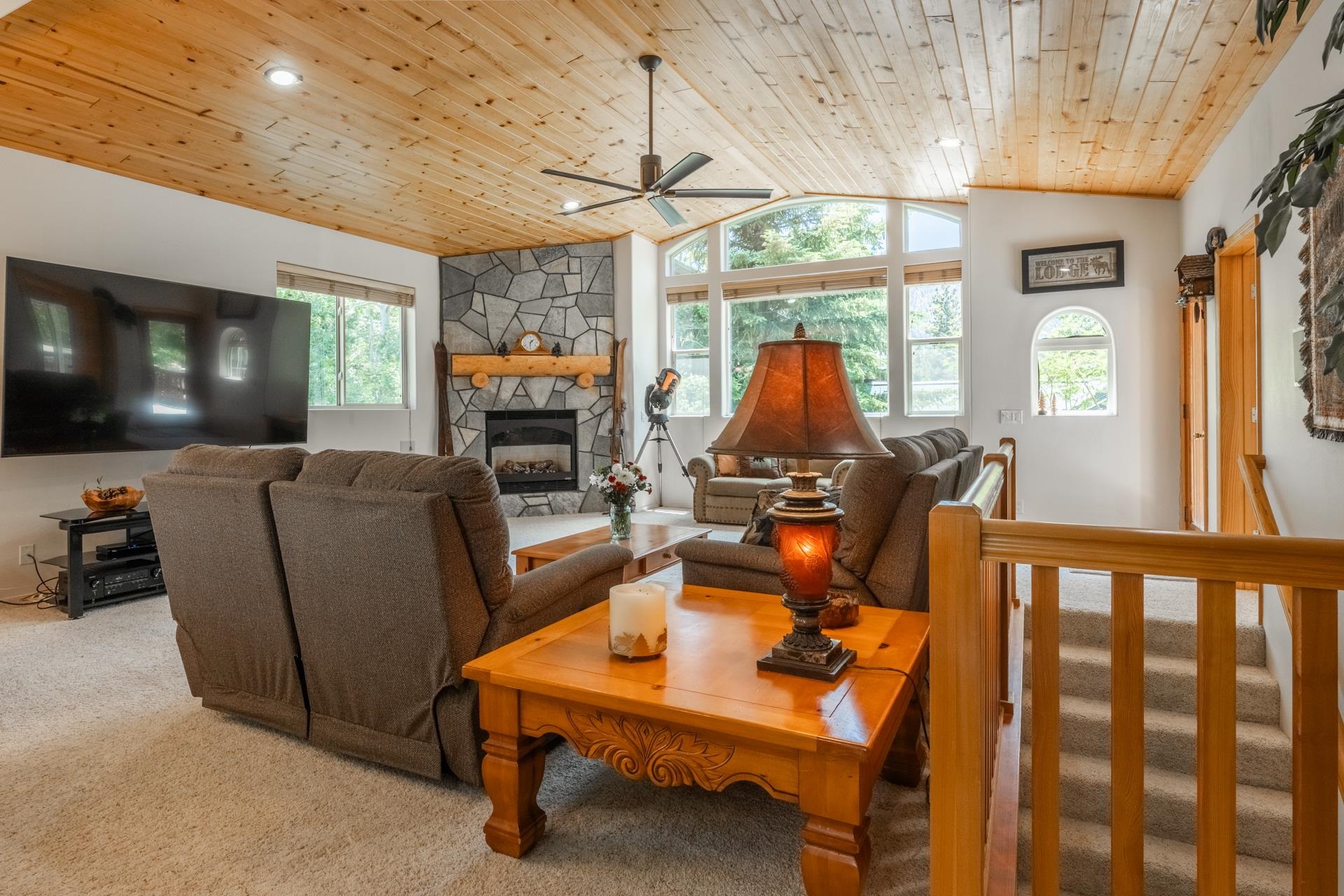 372 Wagon Wheel Road Mammoth Lakes, CA 93546 - Photo 5 of 50 a living room with furniture a flat screen tv and floor to ceiling window