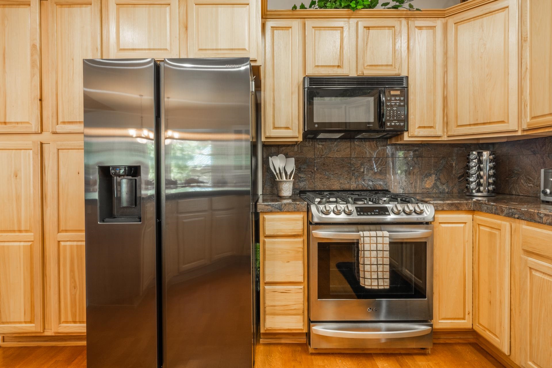 372 Wagon Wheel Road Mammoth Lakes, CA 93546 - Photo 10 of 50 a kitchen with stainless steel appliances granite countertop a refrigerator and a stove top oven