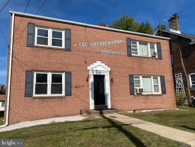 136 Susquehanna Avenue, Unit C Lansdale, PA 19446 - Photo 1 of 8 a front view of a house with a yard
