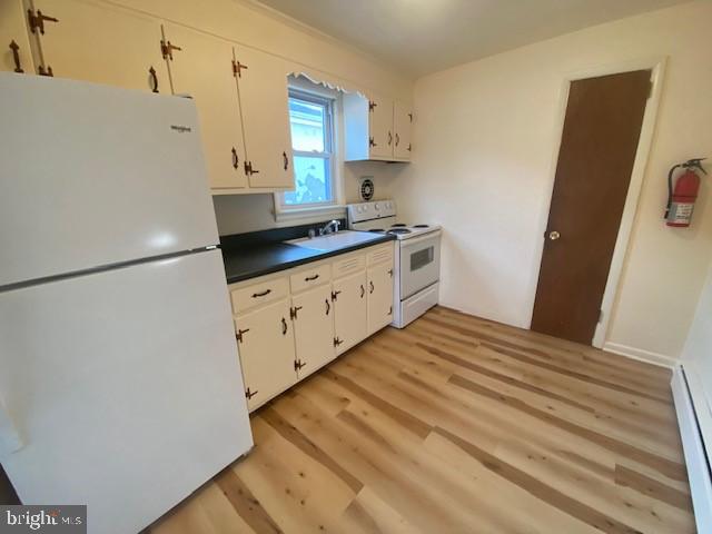 136 Susquehanna Avenue, Unit C Lansdale, PA 19446 - Photo 2 of 8 a kitchen with granite countertop white cabinets and white appliances