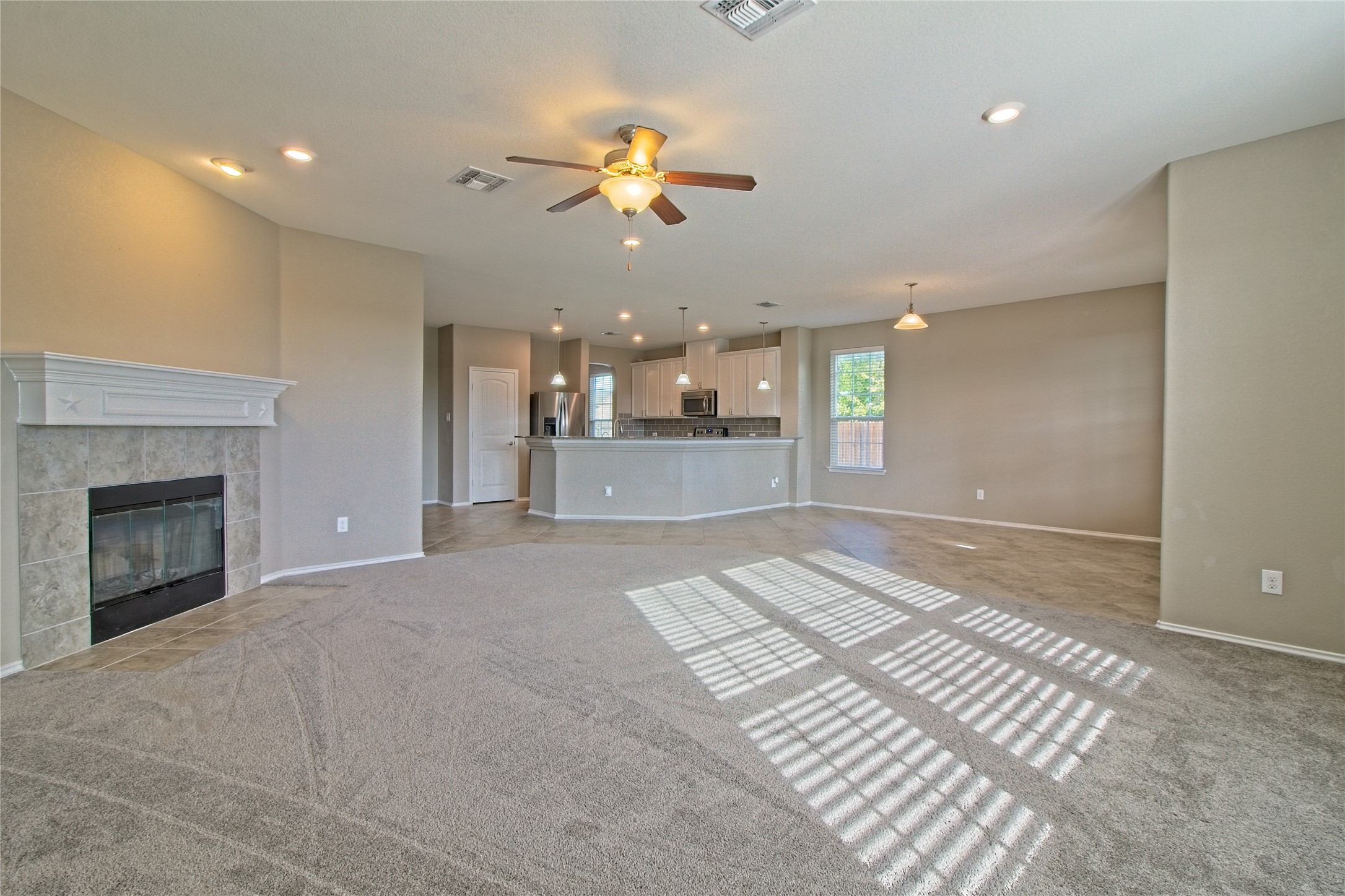 31443 Kingsway Road Georgetown, TX 78628 - Photo 40 of 40 An open floor plan provides a seamless flow from the sun-filled living area to the kitchen.