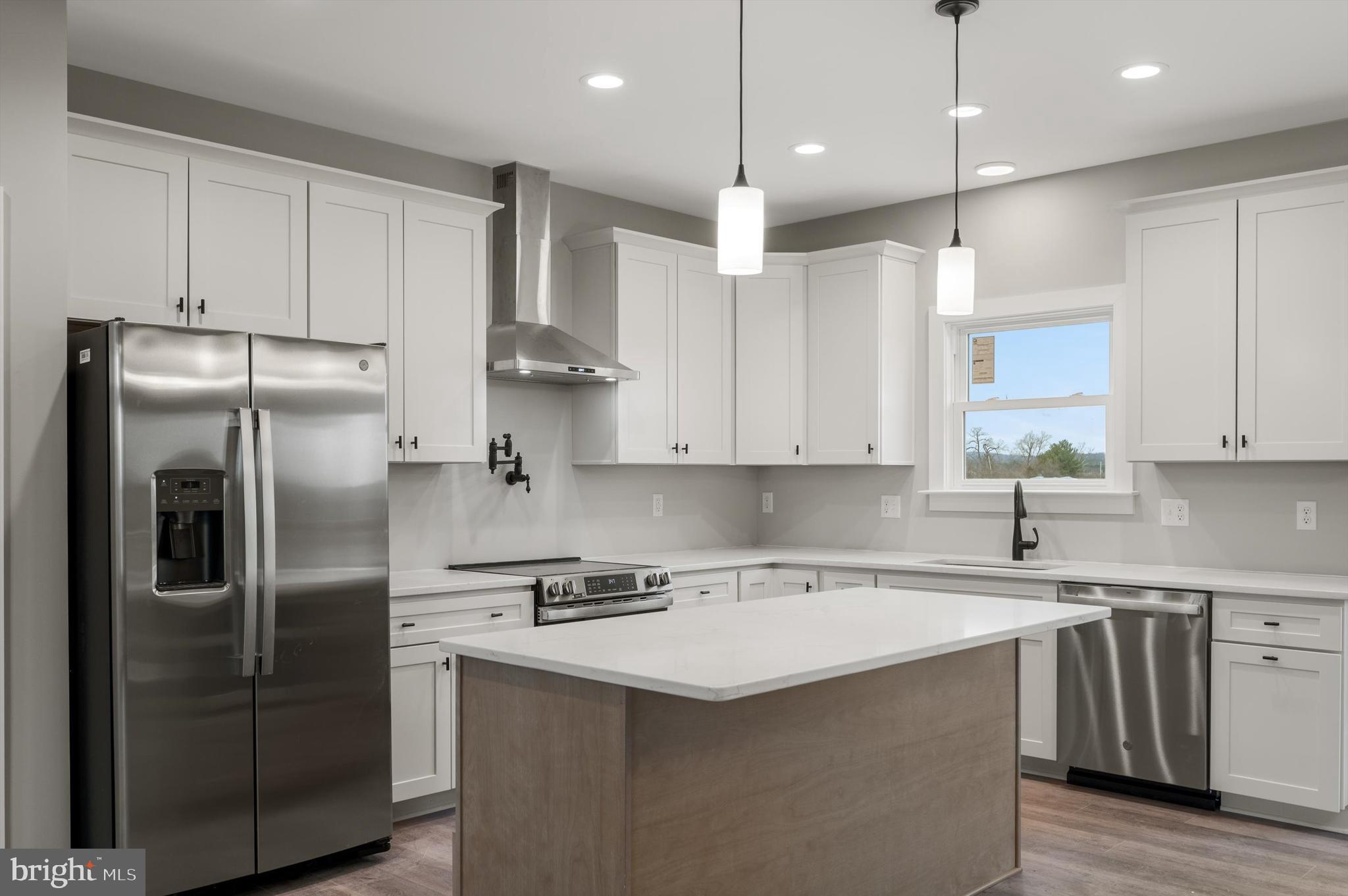 309 Gun Club Road Stephenson, VA 22656 - Photo 12 of 41 a kitchen with stainless steel appliances granite countertop a refrigerator a sink and a stove