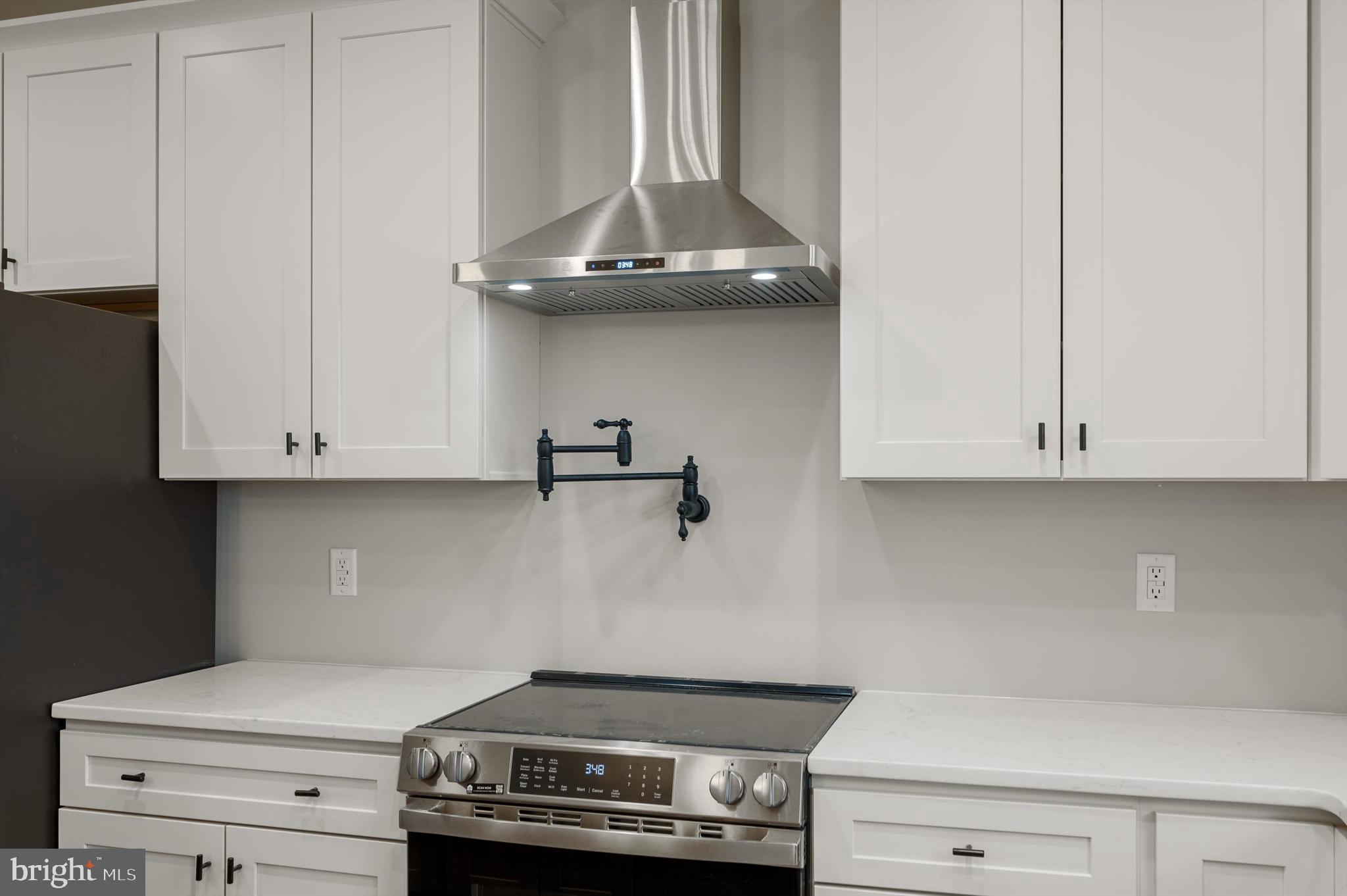 309 Gun Club Road Stephenson, VA 22656 - Photo 14 of 41 a kitchen with a stove and cabinets