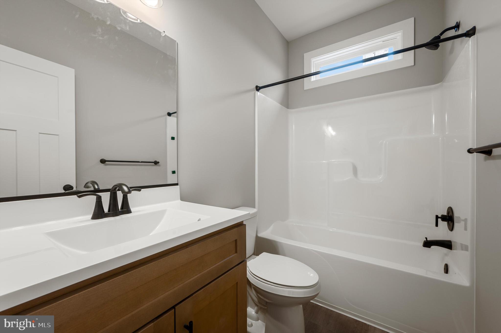 309 Gun Club Road Stephenson, VA 22656 - Photo 18 of 41 a bathroom with a sink a toilet and shower