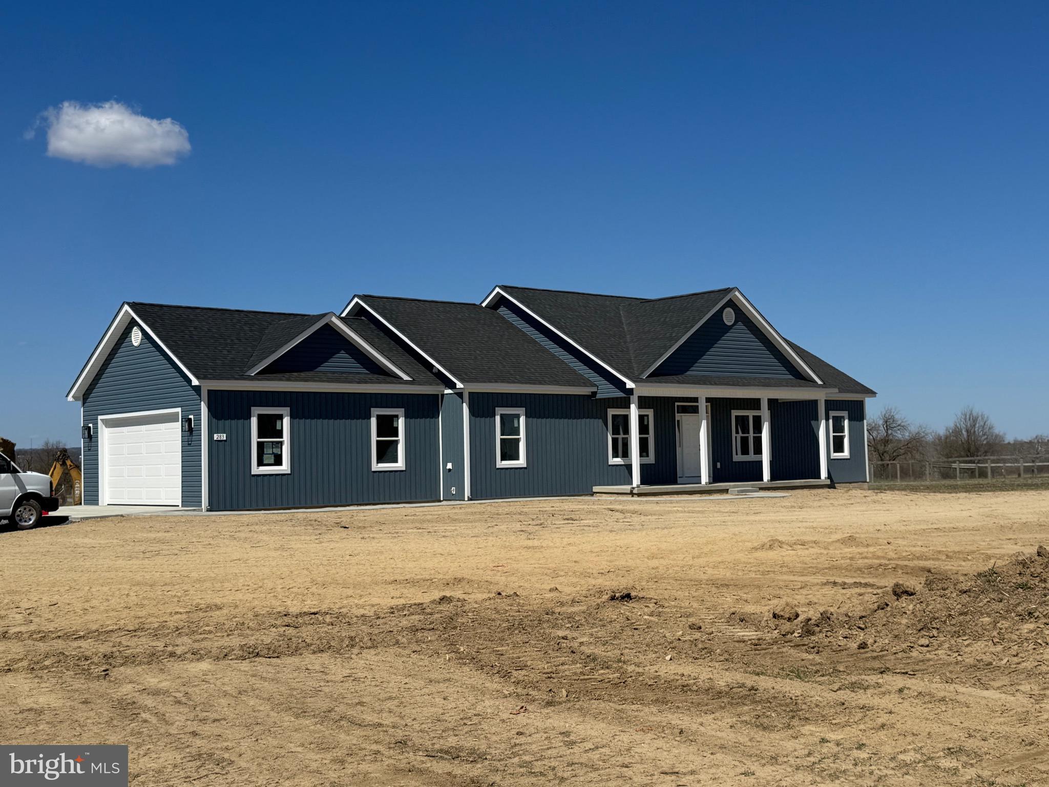 309 Gun Club Road Stephenson, VA 22656 - Photo 2 of 41 a front view of a house with a yard