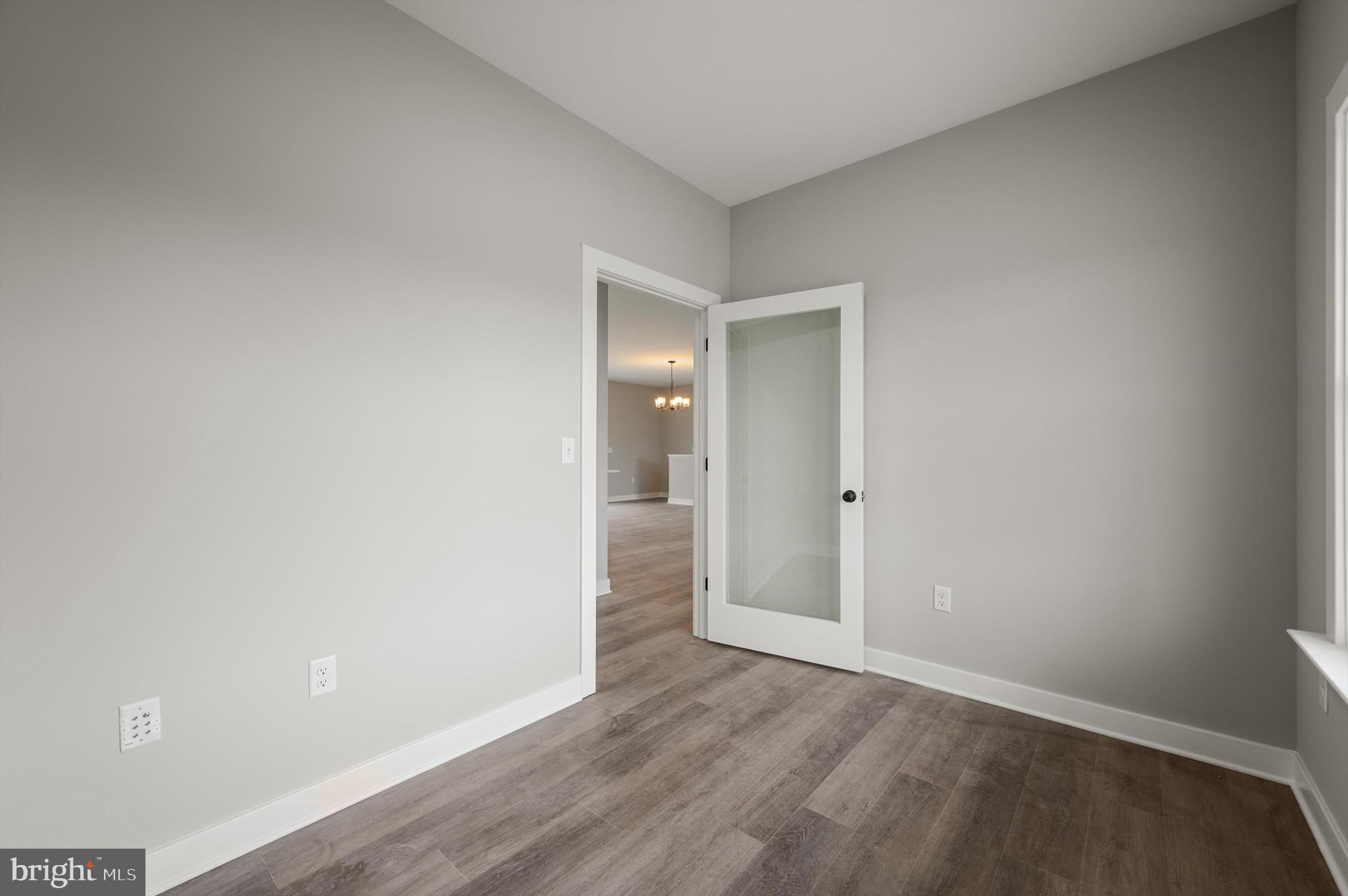 309 Gun Club Road Stephenson, VA 22656 - Photo 22 of 41 a view of an empty room and wooden floor