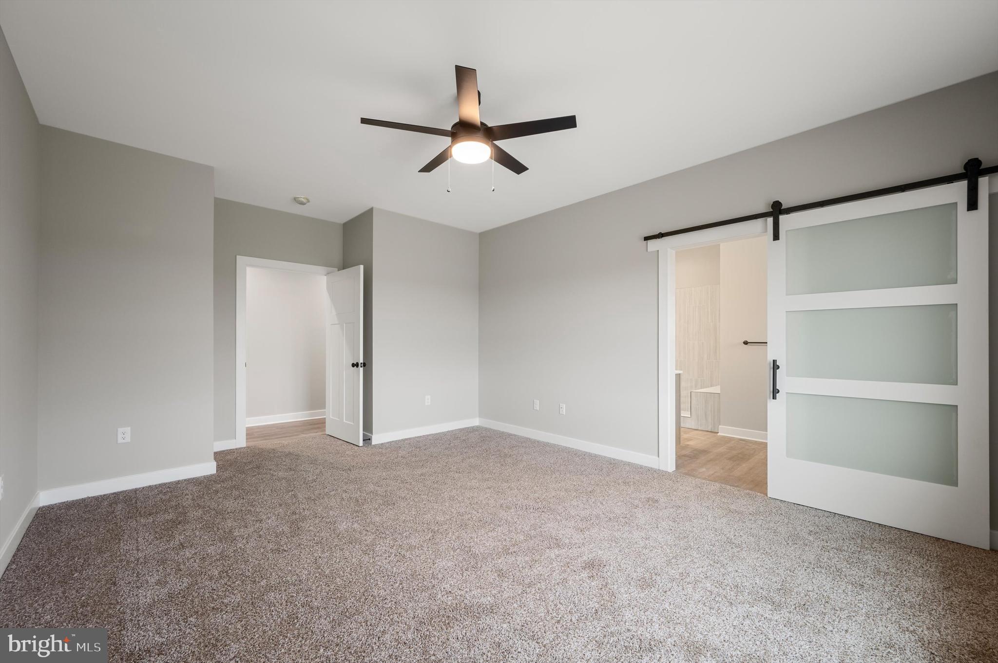 309 Gun Club Road Stephenson, VA 22656 - Photo 24 of 41 a view of an empty room with a ceiling fan