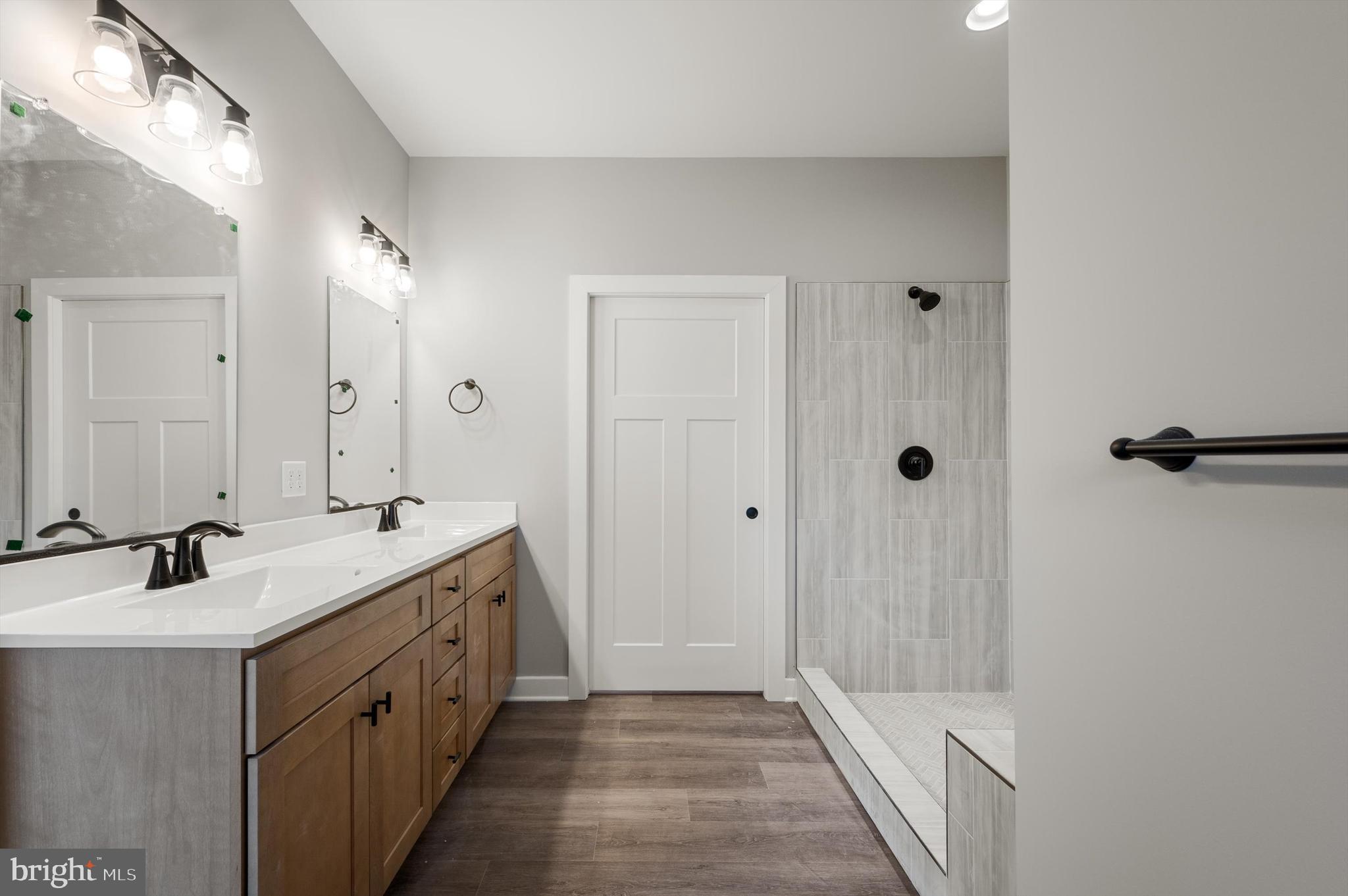 309 Gun Club Road Stephenson, VA 22656 - Photo 27 of 41 a bathroom with a double vanity sink and a mirror