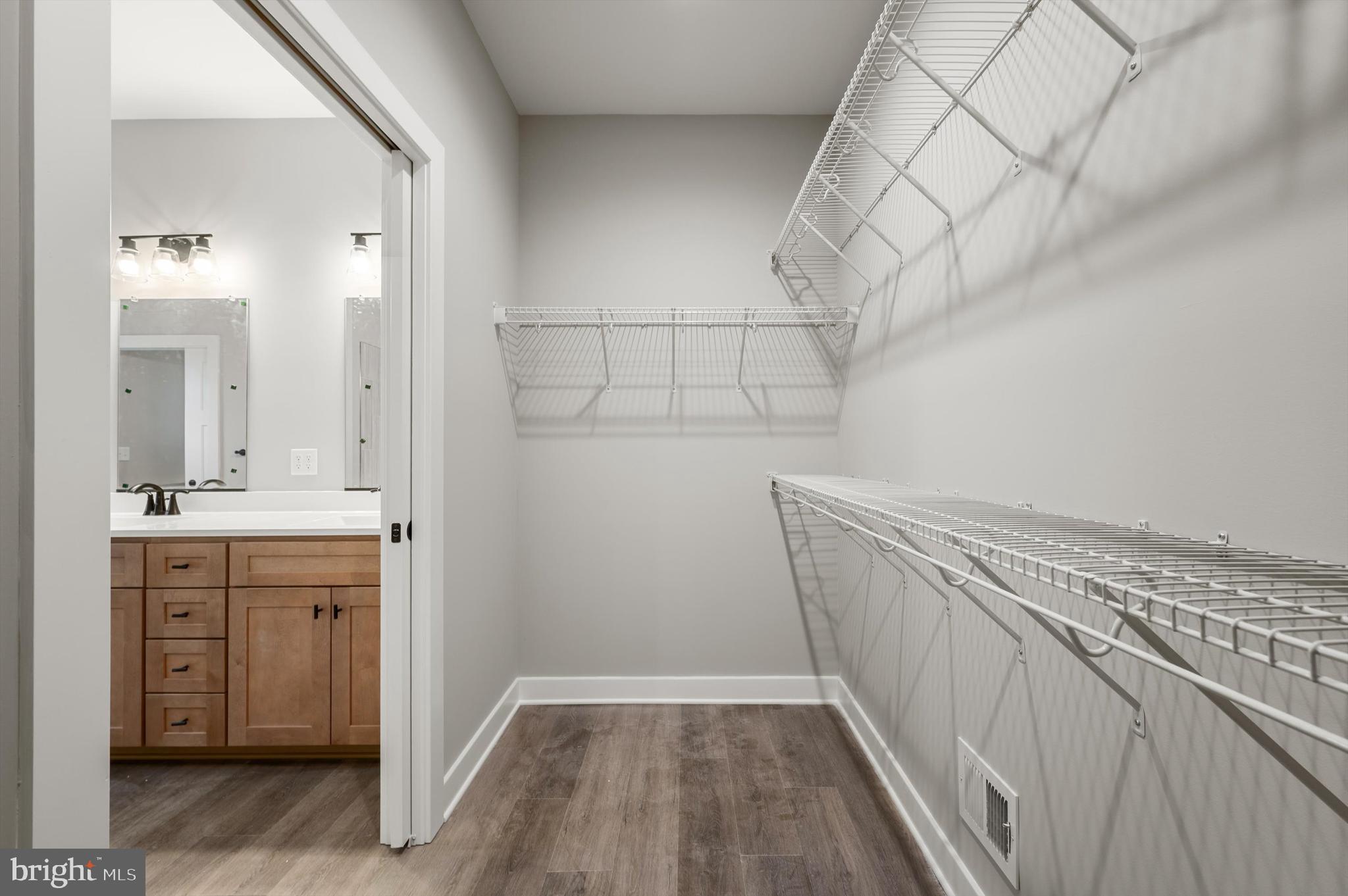 309 Gun Club Road Stephenson, VA 22656 - Photo 30 of 41 a view of hallway with granite countertop a sink and dishwasher with wooden floor