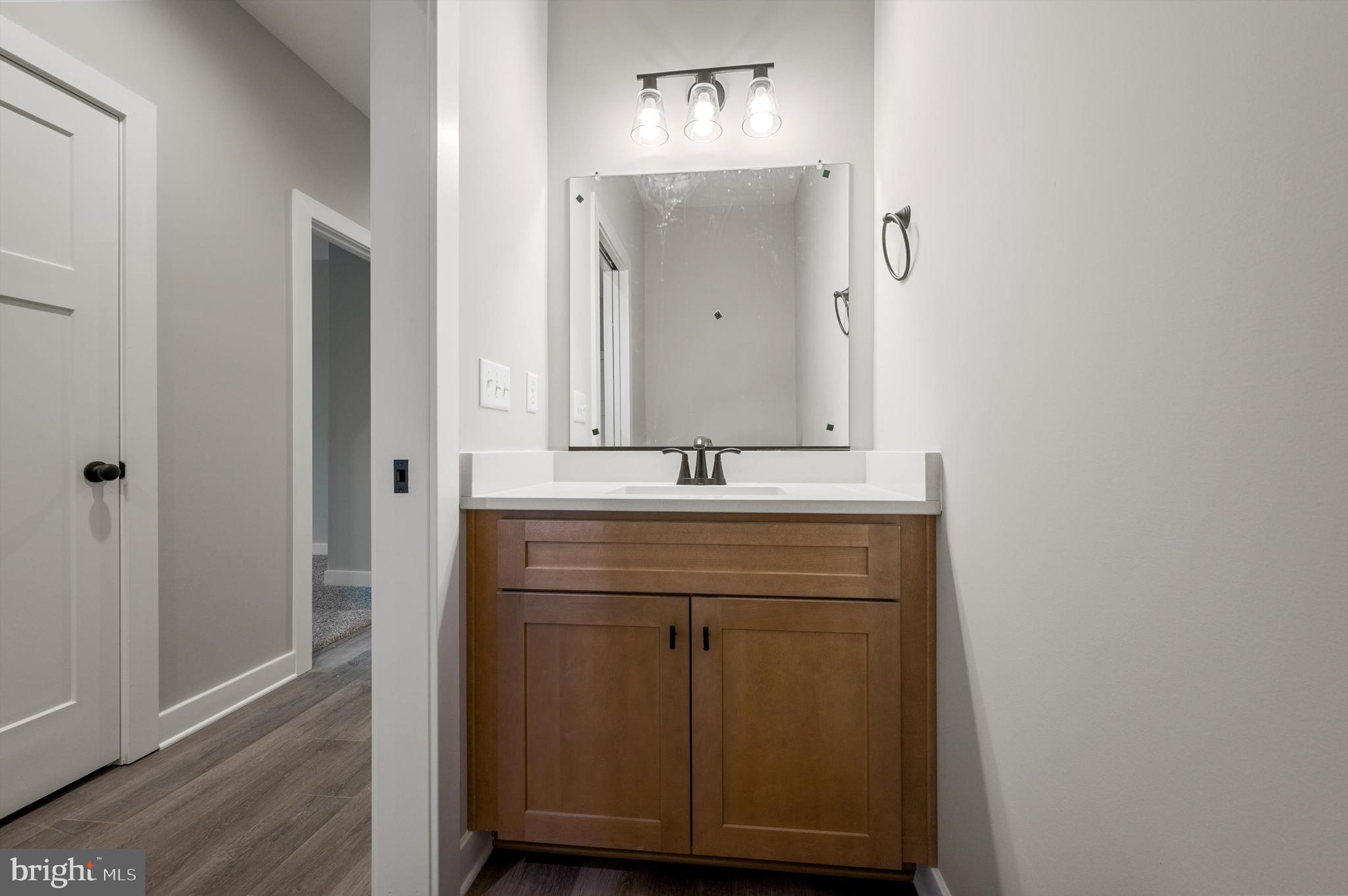 309 Gun Club Road Stephenson, VA 22656 - Photo 33 of 41 a bathroom with a sink and a mirror