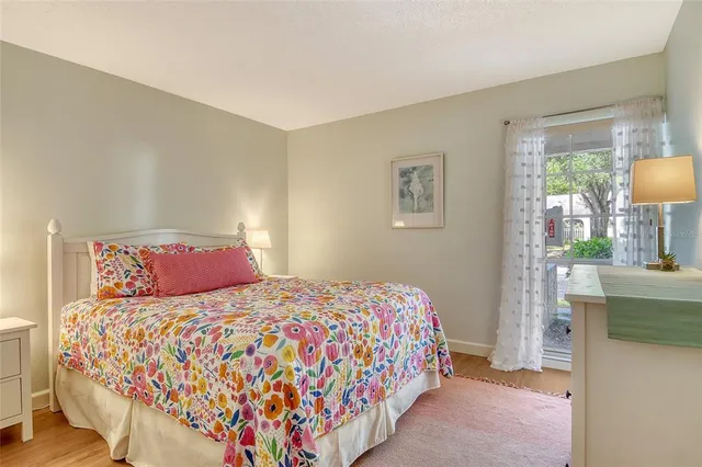 a bedroom with a bed and a table in it