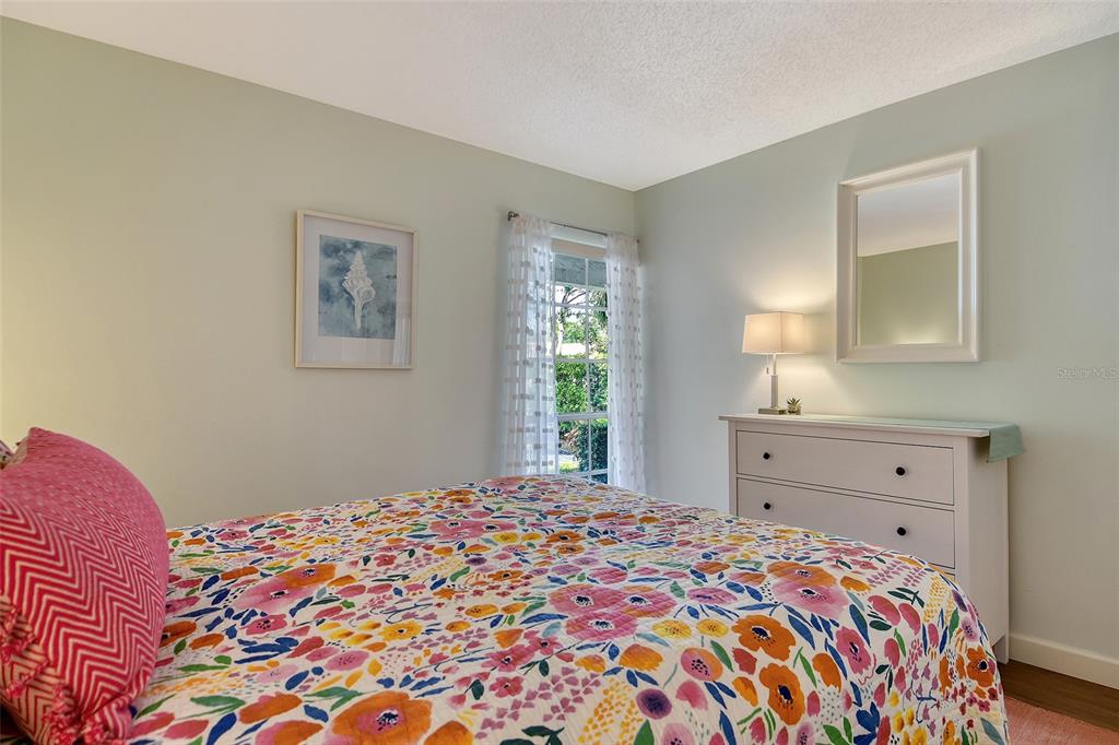 5246 Marsh Field Lane, Unit 1 Sarasota, FL 34235 - Photo 24 of 49 a bedroom with a bed and a window