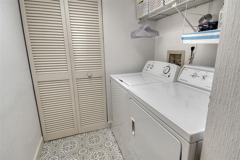 5246 Marsh Field Lane, Unit 1 Sarasota, FL 34235 - Photo 26 of 49 a utility room with dryer and washer