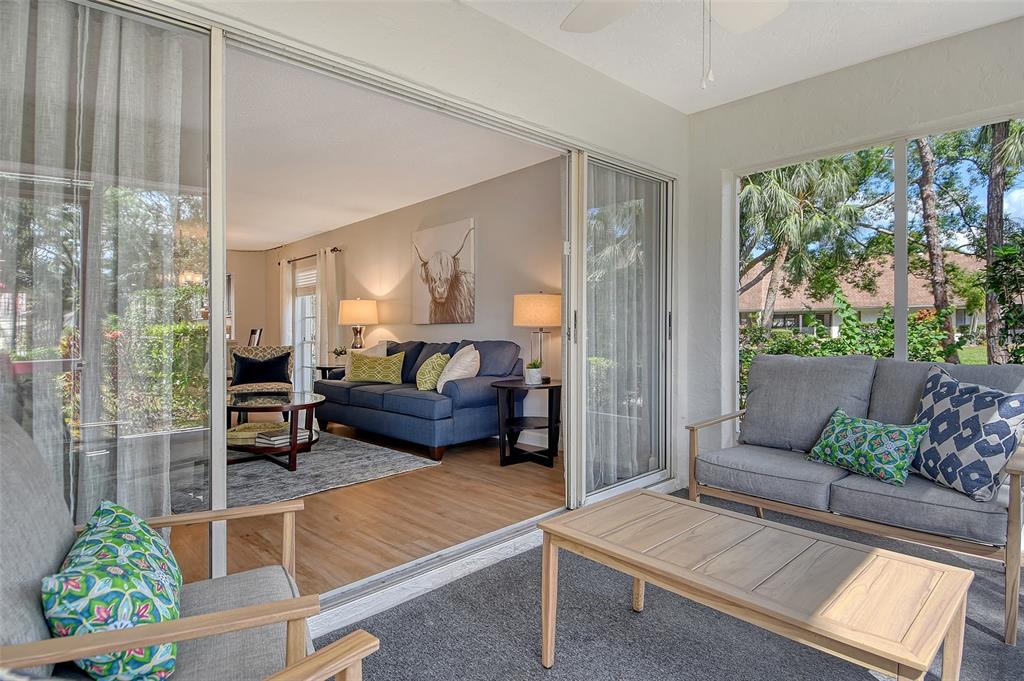 5246 Marsh Field Lane, Unit 1 Sarasota, FL 34235 - Photo 29 of 49 a living room with furniture and a large window