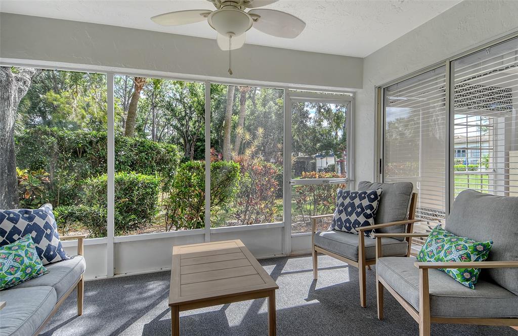 5246 Marsh Field Lane, Unit 1 Sarasota, FL 34235 - Photo 30 of 49 a living room with furniture and a large window