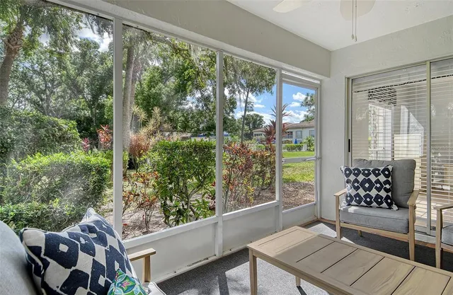 a view of a two chairs in the balcony
