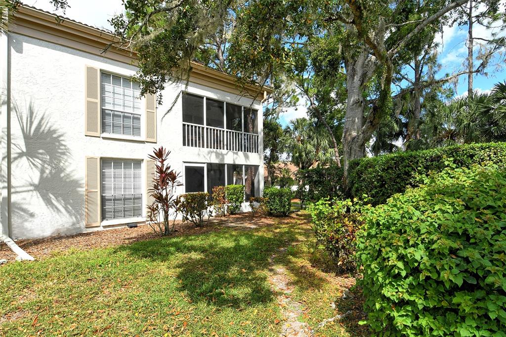 5246 Marsh Field Lane, Unit 1 Sarasota, FL 34235 - Photo 33 of 49 a view of a house with a yard