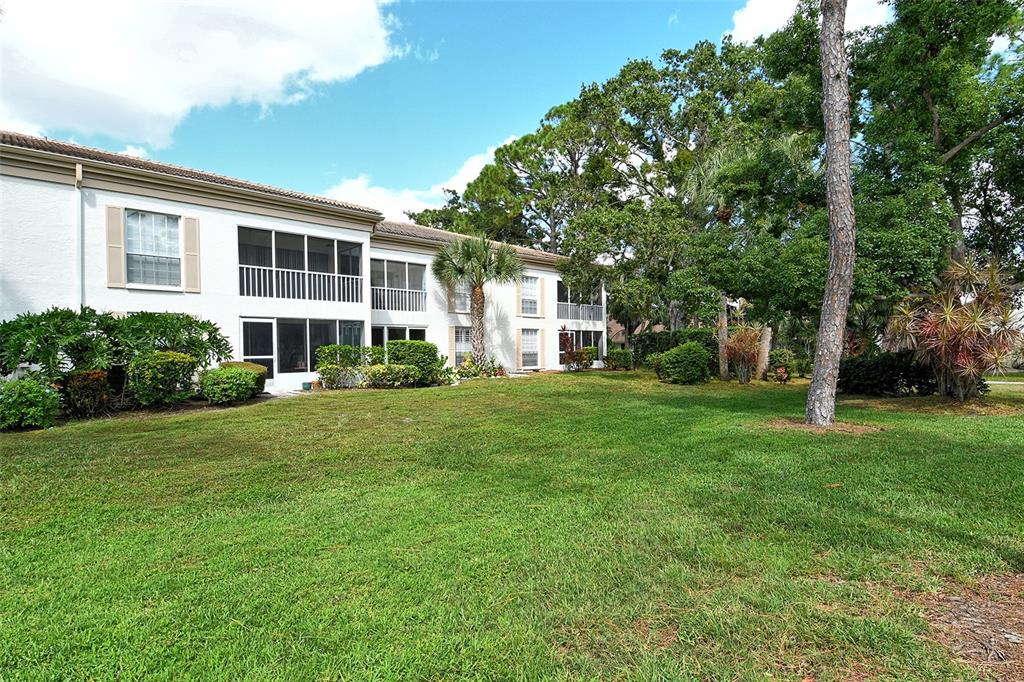 5246 Marsh Field Lane, Unit 1 Sarasota, FL 34235 - Photo 34 of 49 a front view of a house with a yard