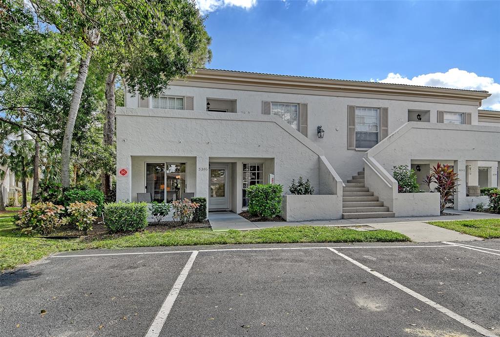 5246 Marsh Field Lane, Unit 1 Sarasota, FL 34235 - Photo 35 of 49 a front view of a house with a yard and garage