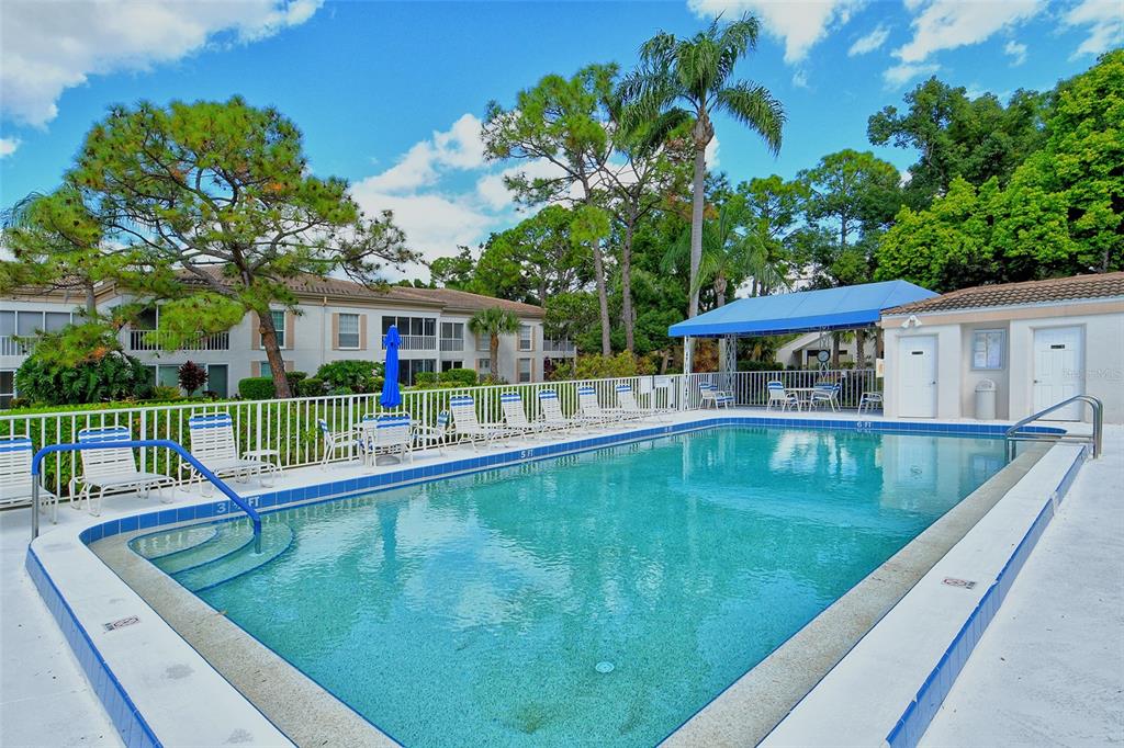 5246 Marsh Field Lane, Unit 1 Sarasota, FL 34235 - Photo 38 of 49 swimming pool view with a seating space and a garden view