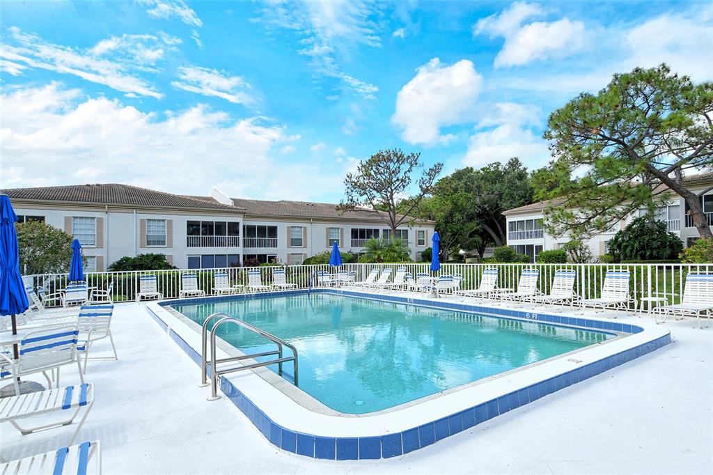 5246 Marsh Field Lane, Unit 1 Sarasota, FL 34235 - Photo 39 of 49 a view of a house with swimming pool and sitting area